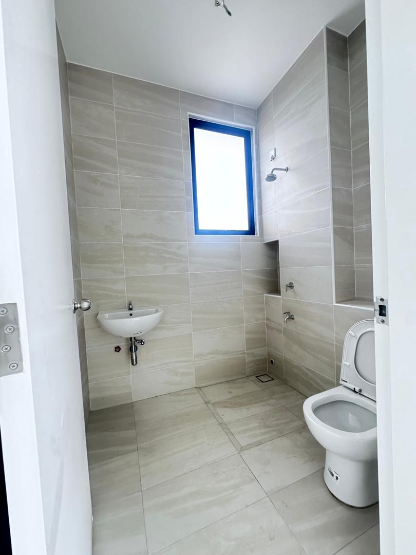 New bathroom with neutral wall tiles